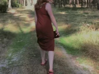 Playful Redhead Pissing In Forest And Showing Her Big Boobs screenshot 2