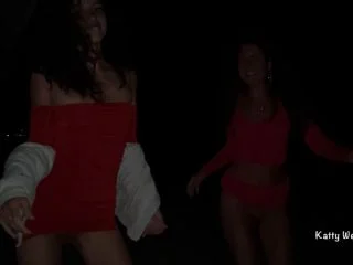 Two Girls Pissing On A Public Promenade On The Beach screenshot 4